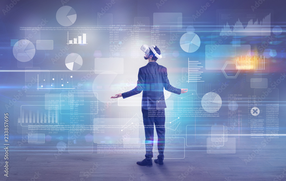 Good looking businessman checking reports and charts with vr glasses
Good looking businessman checking reports and charts with vr glasses