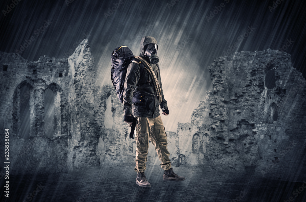Fototapeta premium Hazard, menace man in a ruined crumbly building with arms on his hand 