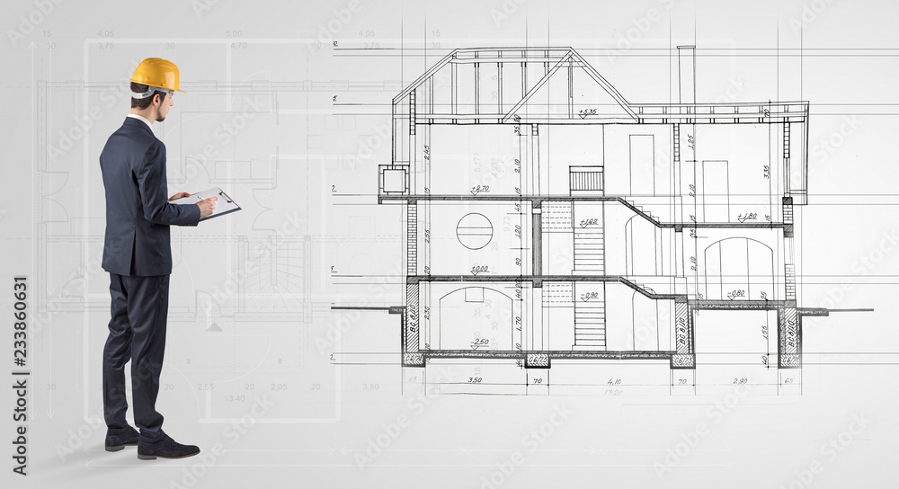 Architect watching a 2 dimension house plan
Architect watching a 2 dimension house plan