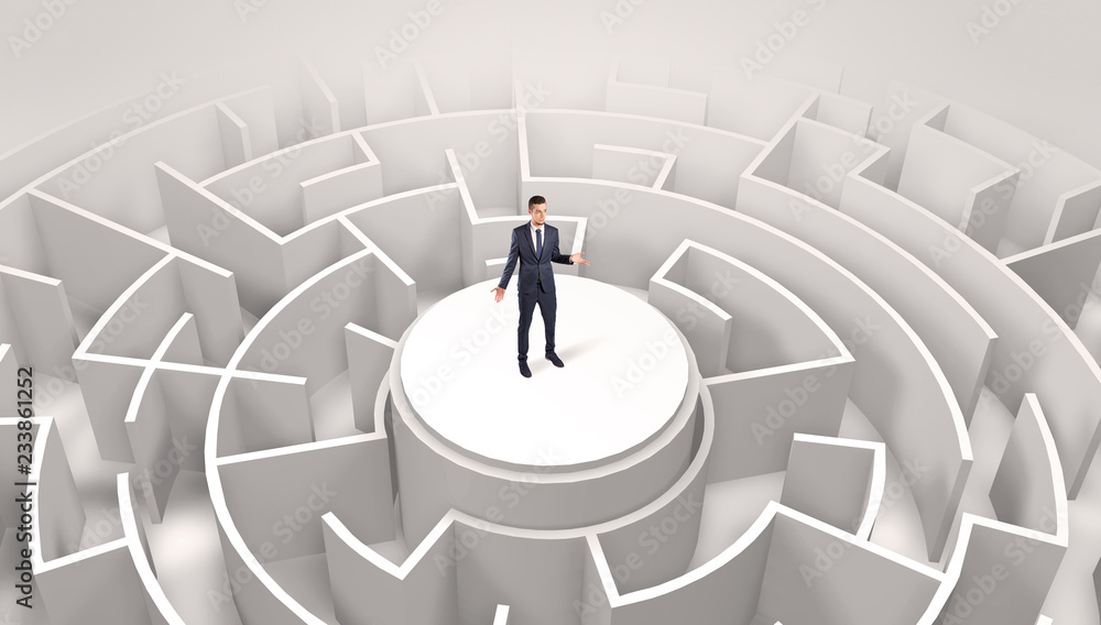 Businessman standing on the top a maze and looking through
Businessman standing on the top a maze and looking through