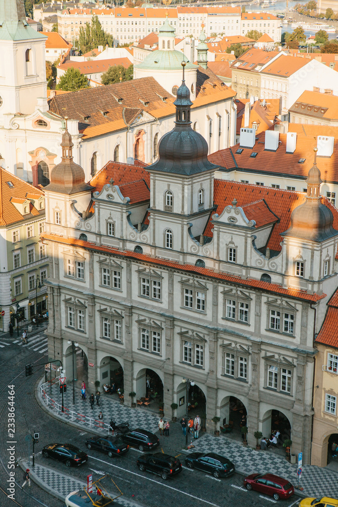 Beautiful aerial view of the traditional old or medieval architecture in Prague in the Czech Republic. Road with cars. Everyday city life.