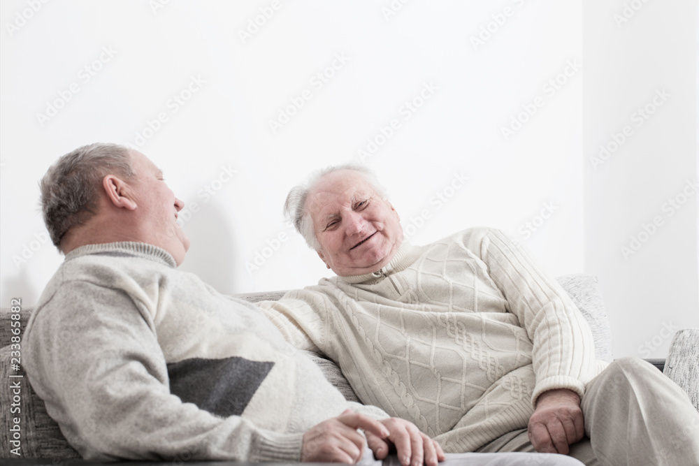 two elderly men indoor