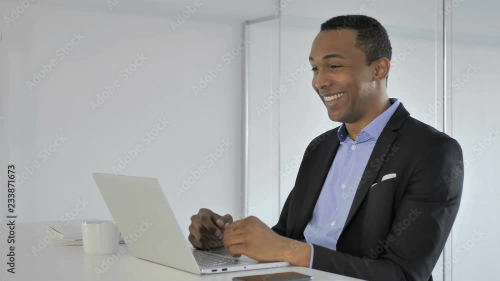 Online Video Chat by Casual Afro-American Businessman Online Video Chat by Casual Afro-American Businessman