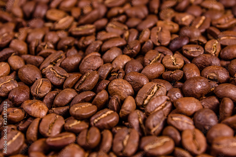Background of many roasted coffee beans. Selective focus Background of many roasted coffee beans. Selective focus