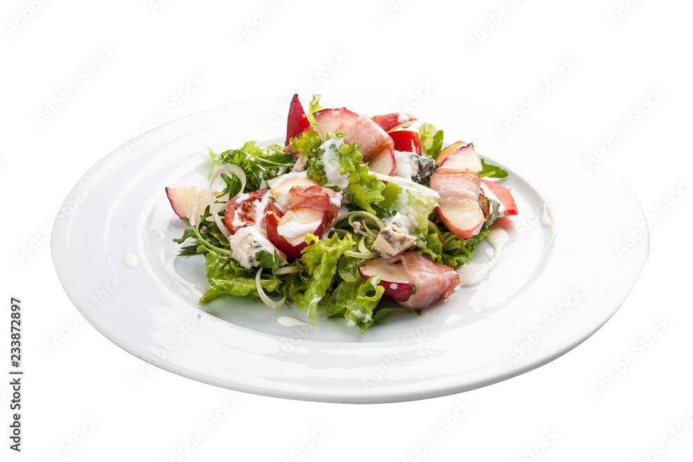 Summer salad with peach, bacon and arugula. On a white background Summer salad with peach, bacon and arugula. On a white background