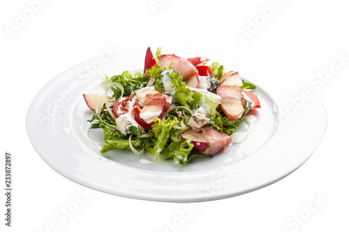 Summer salad with peach, bacon and arugula. On a white background