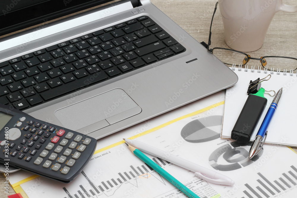 Business concept with a report, money and a calculator Business concept with a report, money and a calculator
