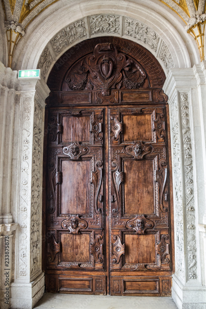 Venice, Italy. Ancient door wood carving decoration in San Marco Cathedral church