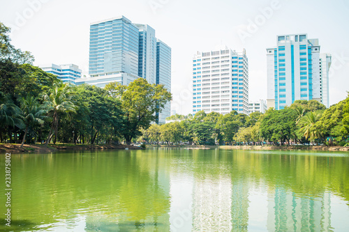 View of tower building Bangkok skyline at Lumphini Park, Pathum Wan districts of Bangkok. © smolaw11