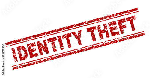 IDENTITY THEFT seal print with distress texture. Red vector rubber print of IDENTITY THEFT text with retro texture. Text label is placed between double parallel lines.