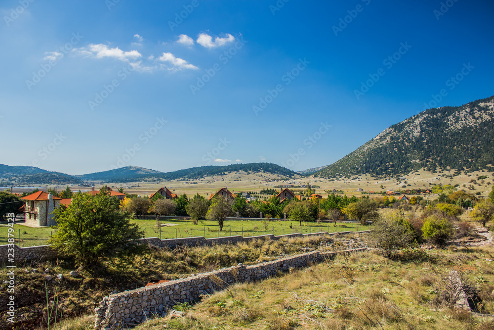 highland country side suburb village in valley between mountains nature scenery landscape place
