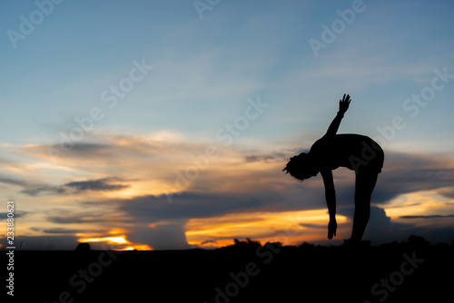 young woman warming up outdoors at park