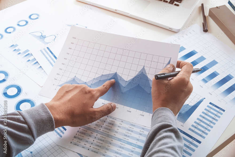 businessman working data document graph chart report marketing research development planning management strategy analysis financial accounting. Business office concept. businessman working data document graph chart report marketing research development planning management strategy analysis financial accounting. Business office concept.