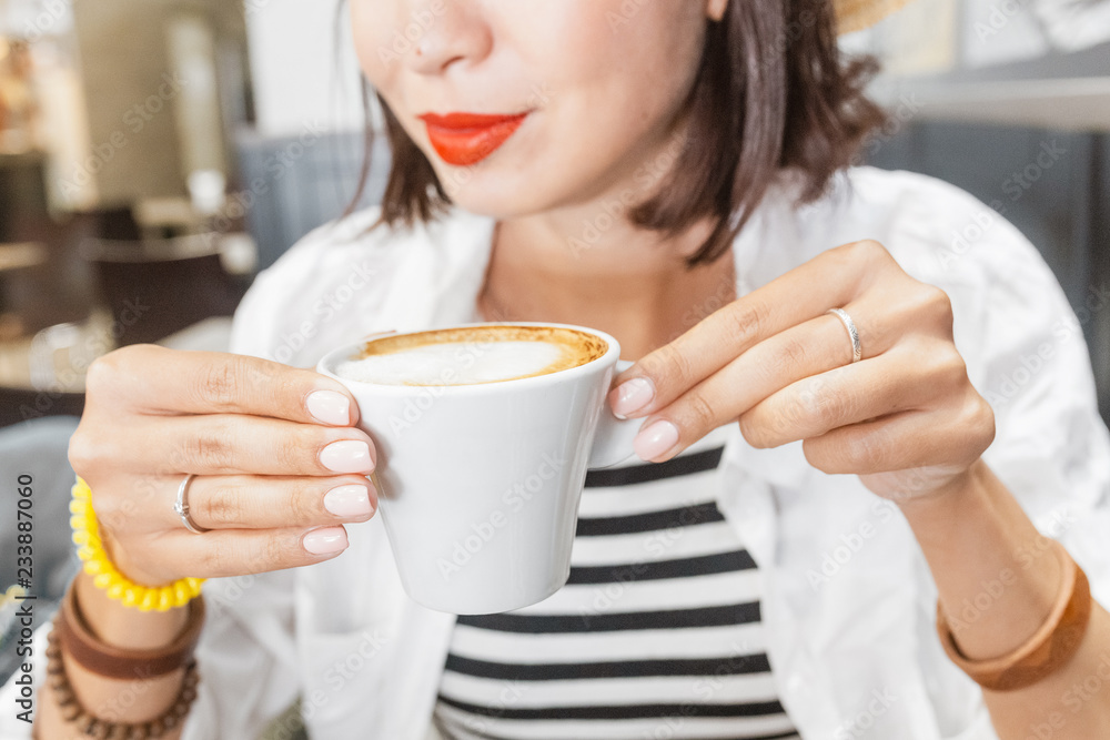 Young women drinking coffee in cafe Young women drinking coffee in cafe