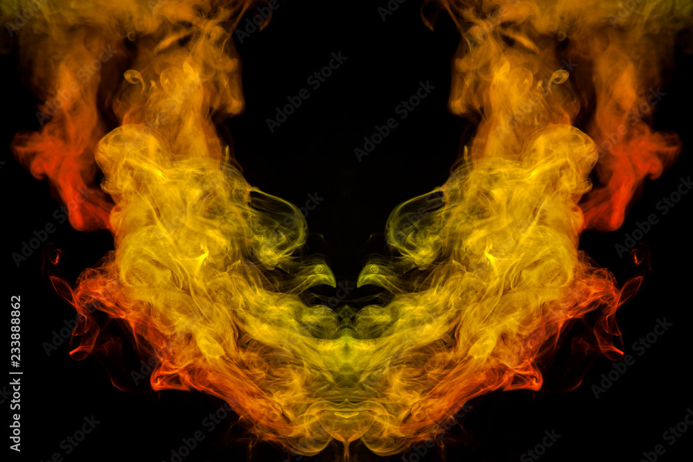 A background of orange, yellow and red wavy smoke in the shape of turned arch of mystical appearance on a black isolated ground. Bright abstract pattern of steam from vape.