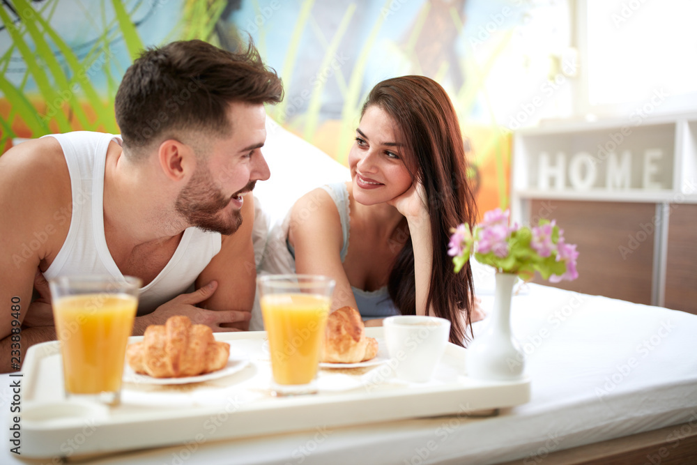 Woman and man in love at morning in bed. Woman and man in love at morning in bed.