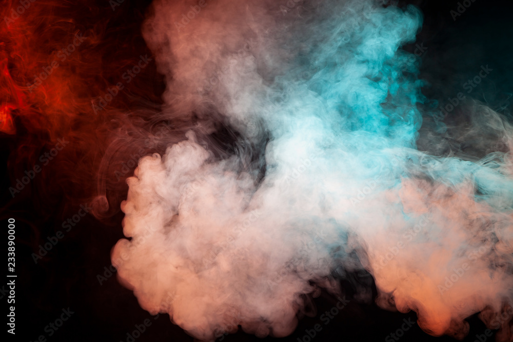Background of green, white and pink wavy smoke on a black isolated ground. Abstract pattern of steam from vape.
