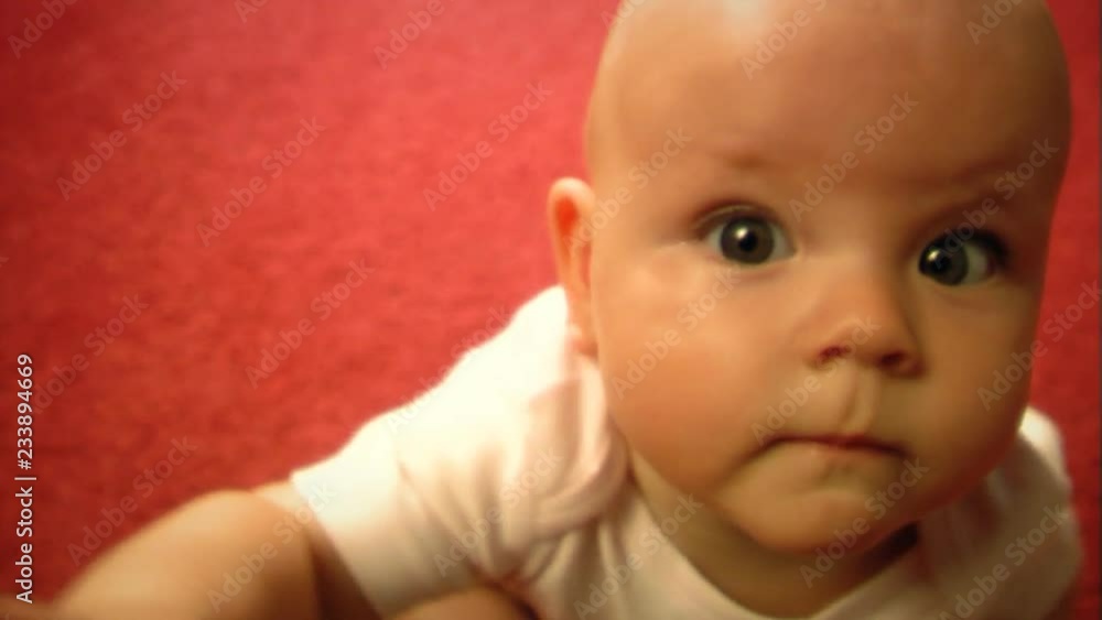 Child sits on the carpet Child sits on the carpet
