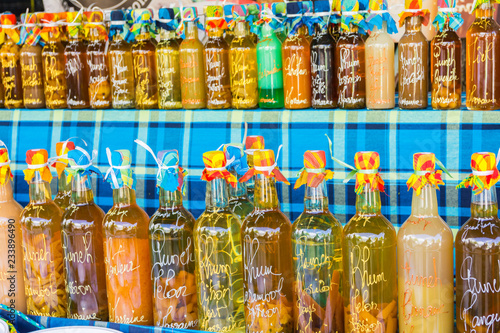 Arranged rum bottles on a local market in Sainte-Anne, Grande-Terre, Guadeloupe