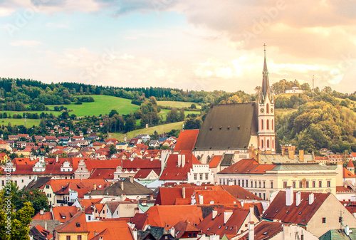 Wallpaper Mural Cesky Krumlov, UNESCO, Czech Republic. Sunset aerial view of the old town pier architecture and St. Vitus Church with red rooftops and houses. Torontodigital.ca