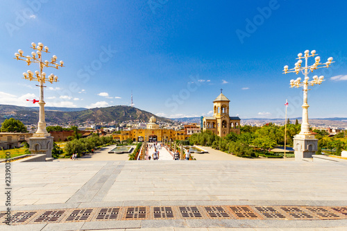 Beautiful view to chapel on site to Sameba Cathedral Tsminda in Tbilisi Holy Trinity . Biggest church Orthodox in Caucasus Georgia region in a sanny day. The main cathedral of the Georgian Orthodoxy