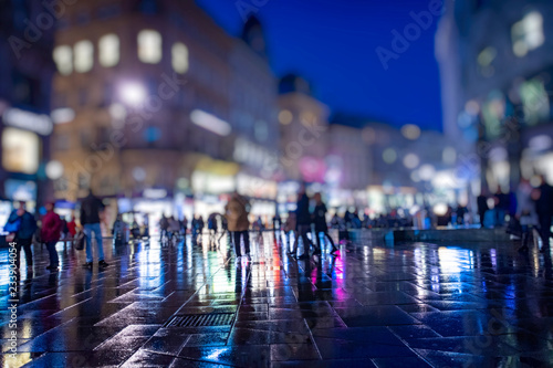 Wallpaper Mural crowd of people walking on the night rainy streets in the city  Torontodigital.ca
