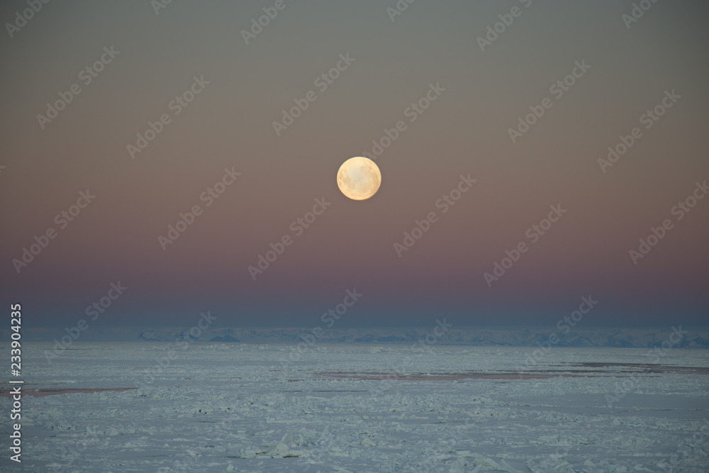 Moon rise over the sea ice of the Antarctic