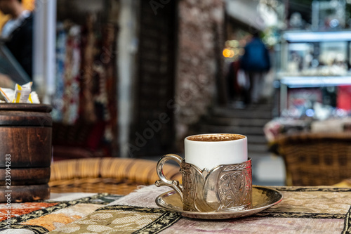 Cup of turkish-style coffe in silver cup-holder at Arasta Bazaar in Istanbul, Turkey