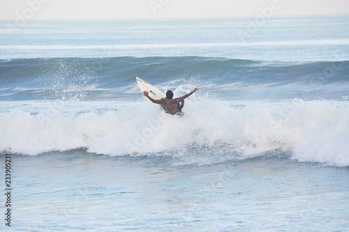 Surfer at Kuta Beach in Bali 