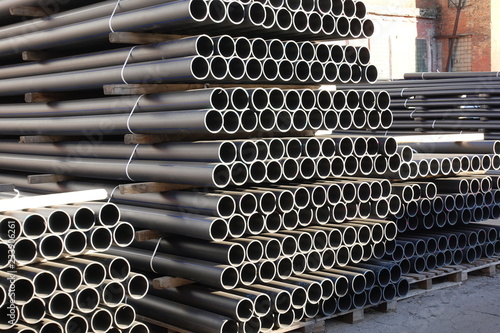 Plastic pipes in stock of finished products stacked in packs