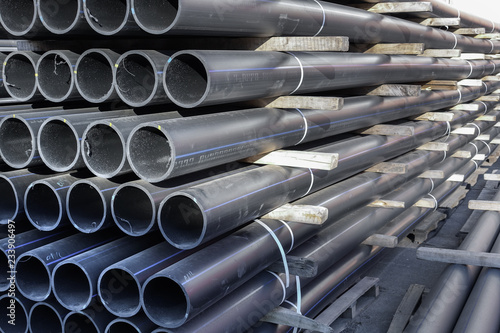 Plastic pipes in stock of finished products stacked in packs