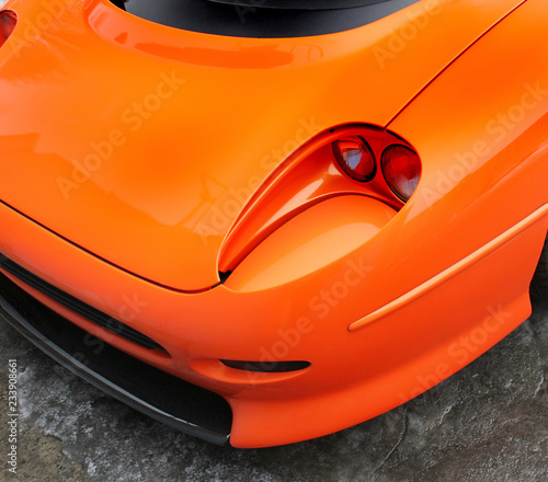 Part of an orange car © Stasiuk