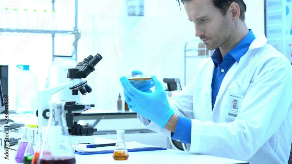 Scientists are experimenting with chemicals compound and absorb liquid the test tube. Concept of science, testing development and lab industry. Scientists are experimenting with chemicals compound and absorb liquid the test tube. Concept of science, testing development and lab industry.