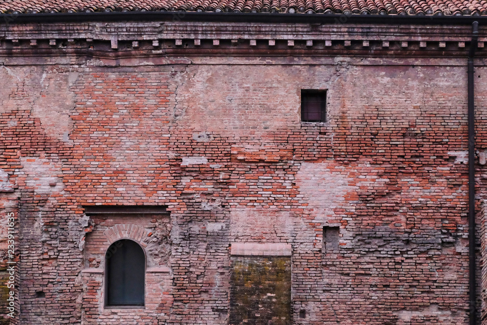 View on an ancient building made of red bricks in Bologna, Italy.  