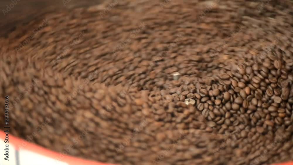 coffee grains rotate in a roaster, coffee roasting