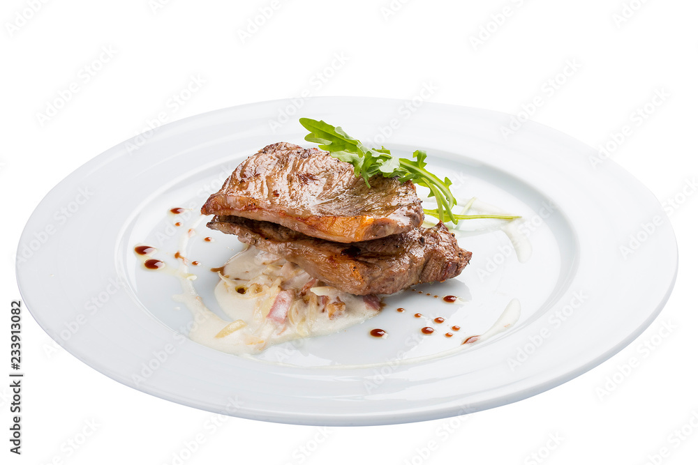 Veal medallion with vegetables. On a white background
