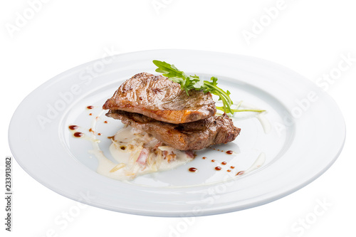 Veal medallion with vegetables. On a white background