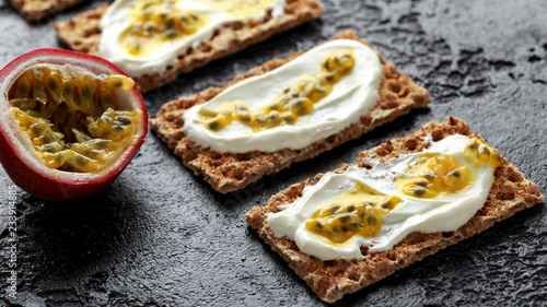Rye breads with soy curd and maracuja, passion fruit. healthy breakfast