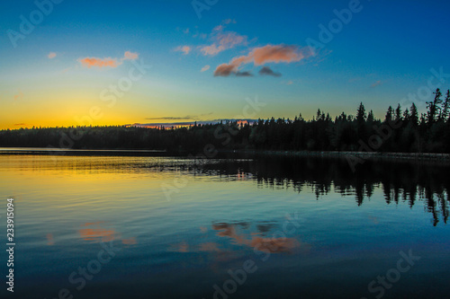 Stunning sunset over Clear Lake, riding Mountain National Park, Manitoba, Canada photo