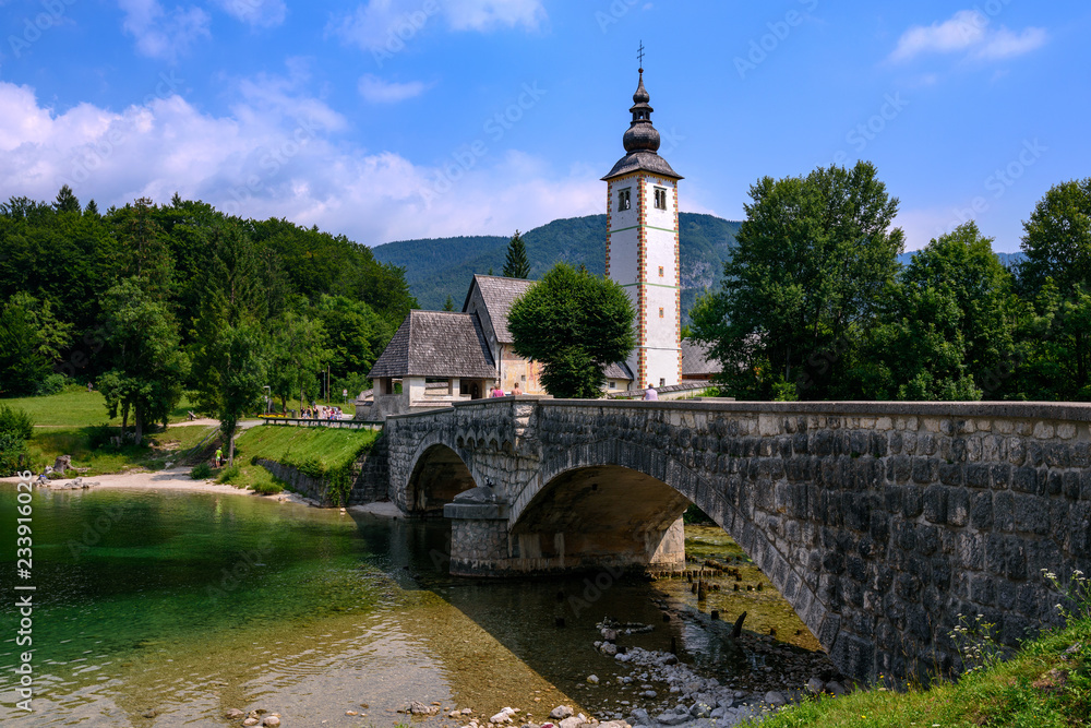 Church of St John the Baptist with bridge. Lake Bohinj. Triglav National Park, Julian Alps, Slovenia