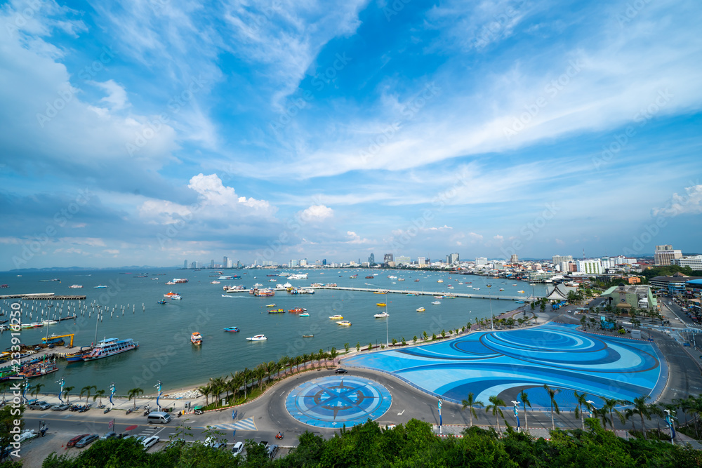 The view of the scenery is filled with the beauty of the sea, the sky and many ships that park in the bay and the city.