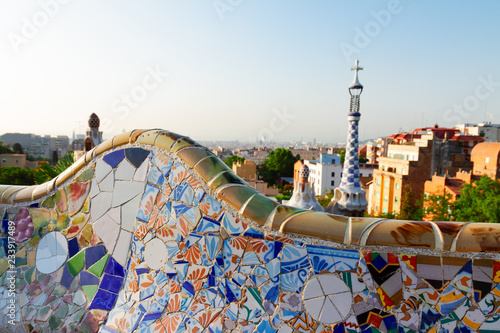 Gaudi mosaic bench and cityscape of Barcelona from park Guell, Spain