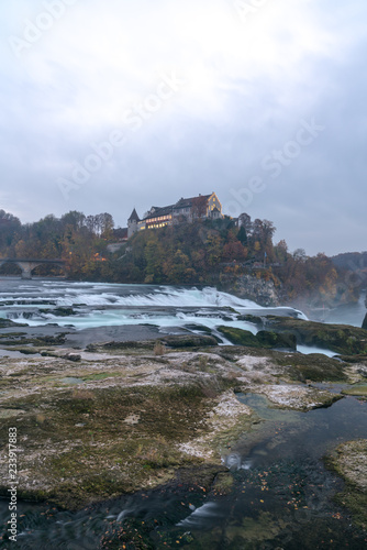 vertical landscape view of the famous Rhine Falls in Switzerland in the evening during twilight