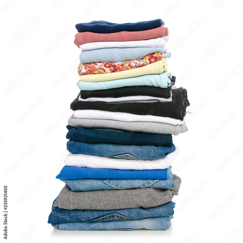 A stack of clothes jeans t-shirt shirt on a white background. Isolation A stack of clothes jeans t-shirt shirt on a white background. Isolation