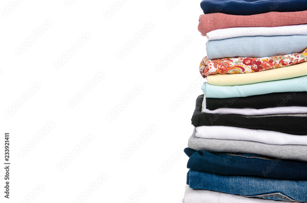 A stack of clothes jeans t-shirt shirt on a white background. Isolation A stack of clothes jeans t-shirt shirt on a white background. Isolation
