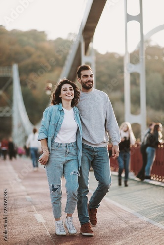 Stylish couple in love hugging on bridge © Olena Bloshchynska