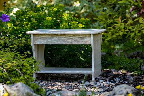 White homemade stool on the background of nature