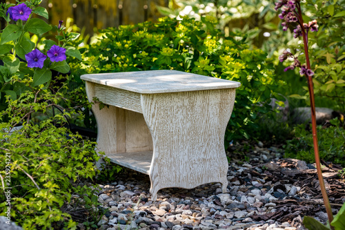 White homemade stool on the background of nature
