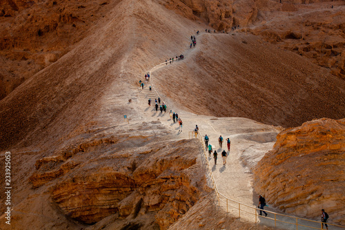 Line of tourists climbed on Masada fortrees rock. Israel. photo