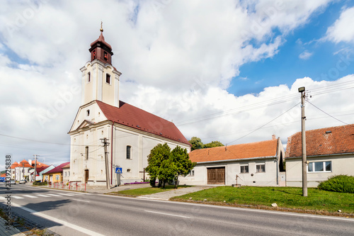 Clouds over church in Trstin - a village in Slovakia